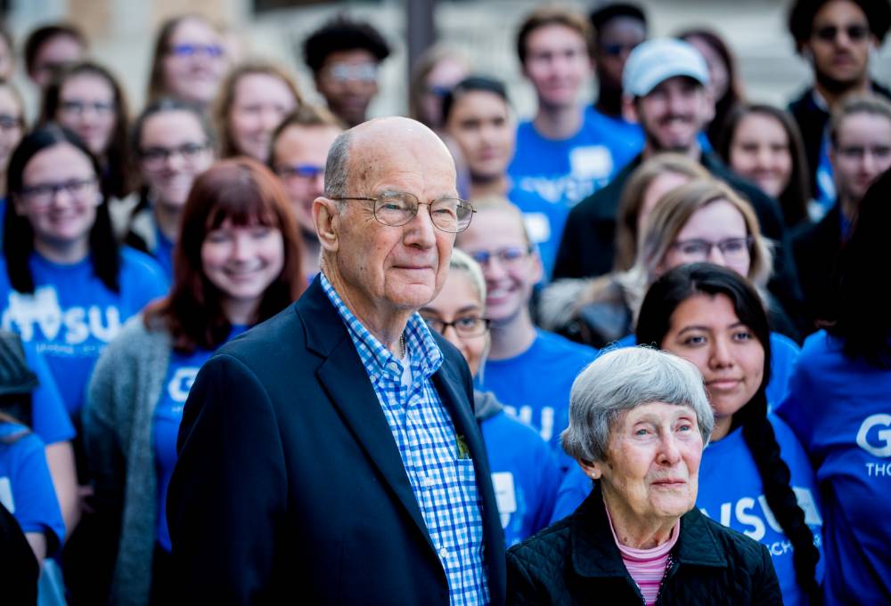 Bob and Ellen Thompson join students for group photo
